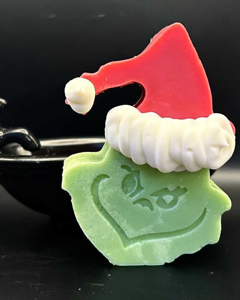 This isn't just a soap; it's a statement. It’s for the individual who appreciates the unconventional; the beauty in the unexpected. It's for the person who understands that a little bit of "bah humbug" can be incredibly refreshing when infused with the right kind of magic. It's the Emerald Enigma, a bar of cold process soap that’s as captivating as its namesake and that offers a cleansing experience that’s anything but ordinary.